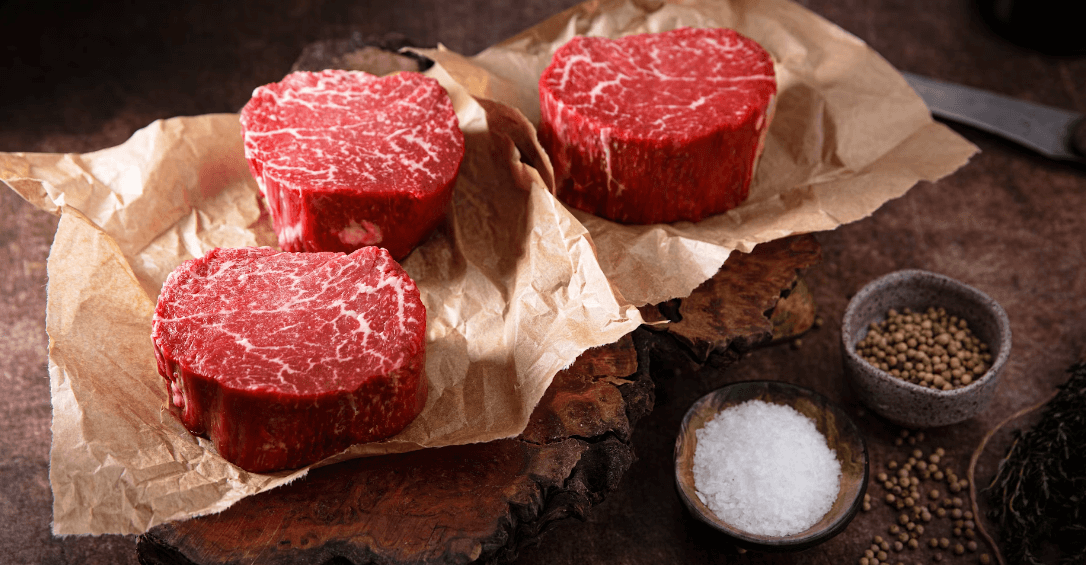 Beef steaks with salt and pepper bowls